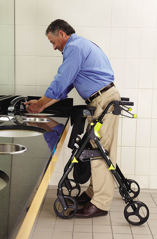 Man using a walker in a bathroom setting
